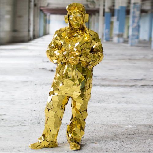 Model in Golden Mirror man perfomance costume Pilot