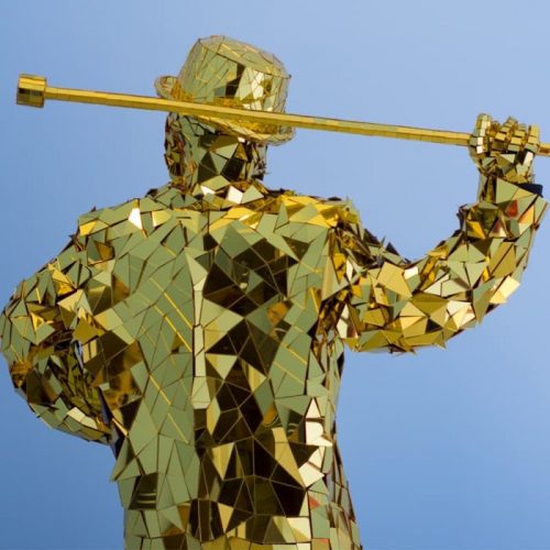 Mirror man in gold with cane