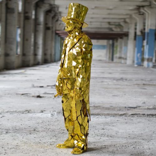 View from sideGold Mirror Man suit with golden cylinder