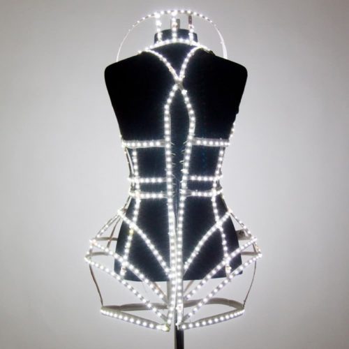 LED cage corset view from back on mannequin with LED light glows in warm white cover