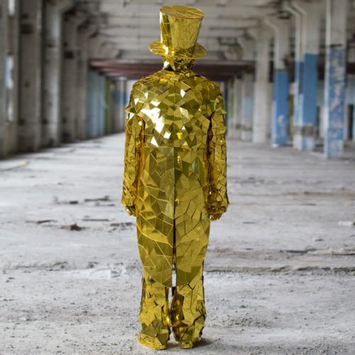 View from back Gold Mirror Man suit with golden cylinder