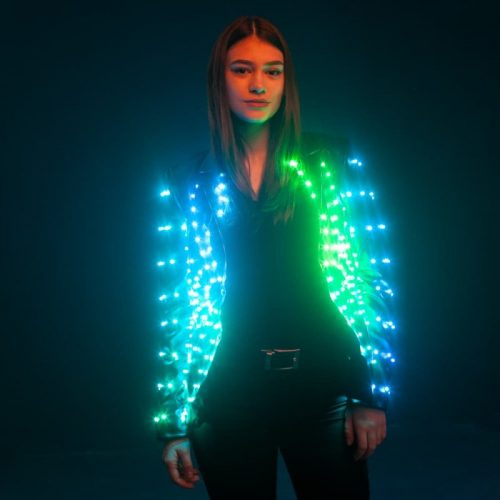 Model trying on new LED jacket photoshoot posu=ing