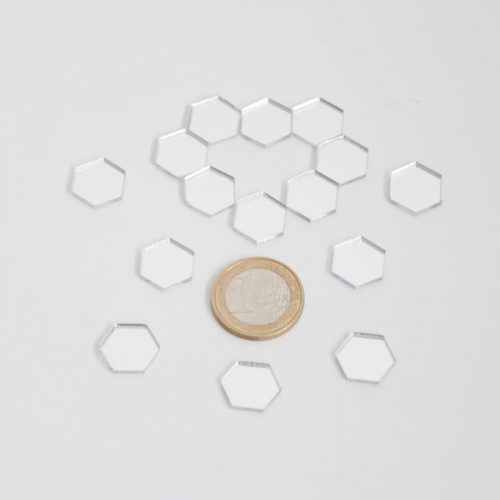 Small silver hexagons comparison with coin