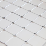 Silver mirror square tiles attached to each other