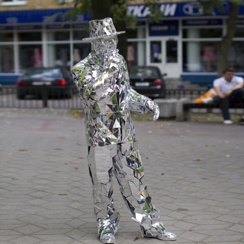 Mirror Man is walking on the street