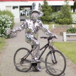 Mirror man glass man performance costume riding on the bicycle
