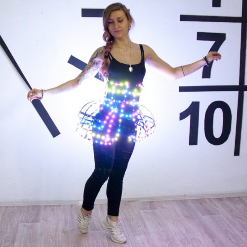 Moodel posing in smart LEd corset butterly