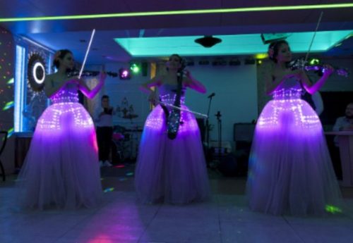 Eevnt with 3 music artist with vilon dressed into LED corsets