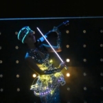 Lady plays on violin wearing into LED smart crset
