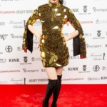 Sequin dress festival with golden mirror on a Avangardista fasion show. Short mirror dress from front