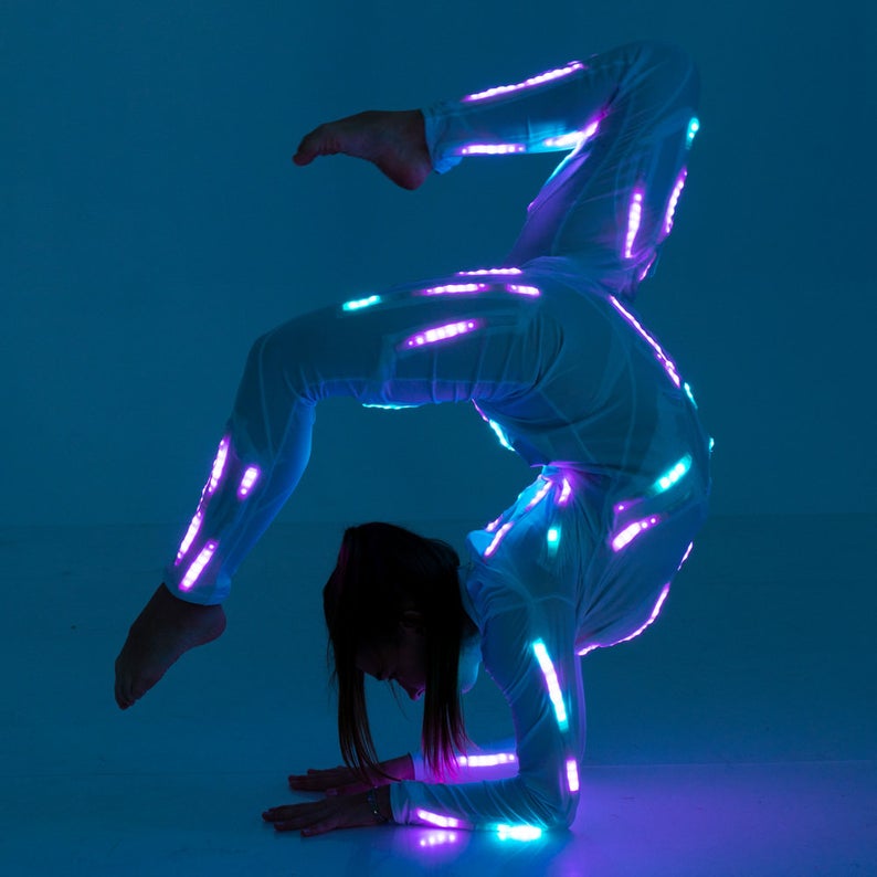 Making acrobtatic trick in Aerial LED light up gymnastics costume