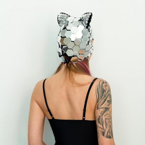 Model posing in Kitty mirror mask "Hexagon" view from back