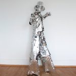 Model making posses in Mirror stilt walker costume