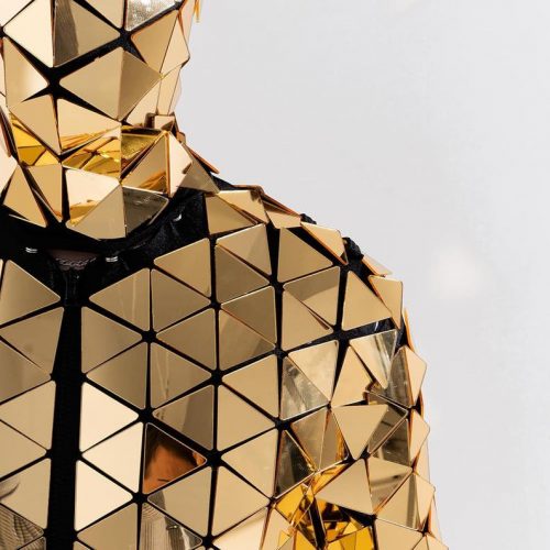 Shoulder area of Gold Triangle disco ball mirror bodysuit costume