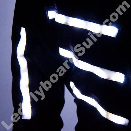 White glowing strips on the LED costume