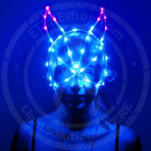 Model staing stright in a LED light up cage mask of Bunny