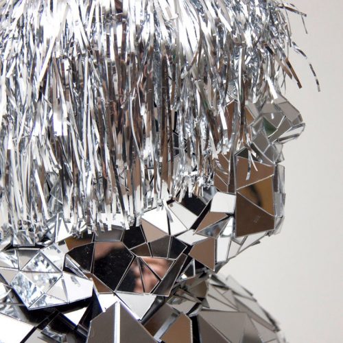 Detail hear view of Mirror man "Hair" glass man performance costume