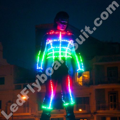 Girl is flying on flybooard and wearing a LED suit
