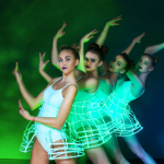 Dance team wearings white corset butterfly