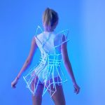 Model possing in a from backRave LED light up Cage dress outfit / fashion festival costume clothing