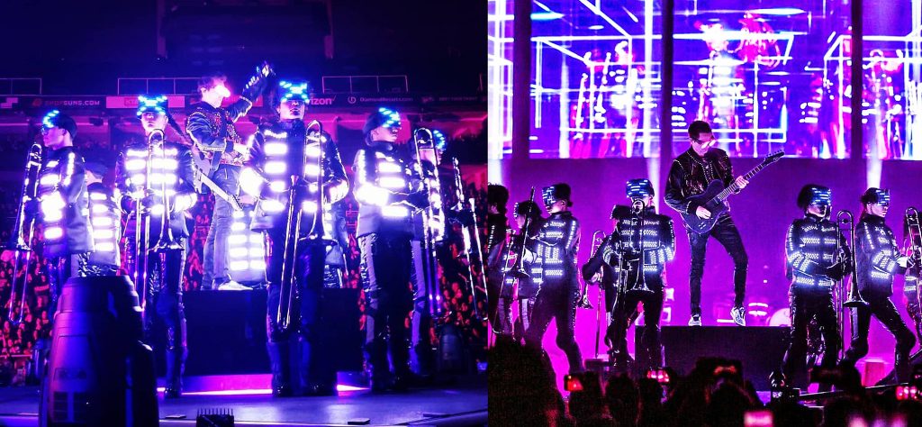 Muse musicians wearing LED suits