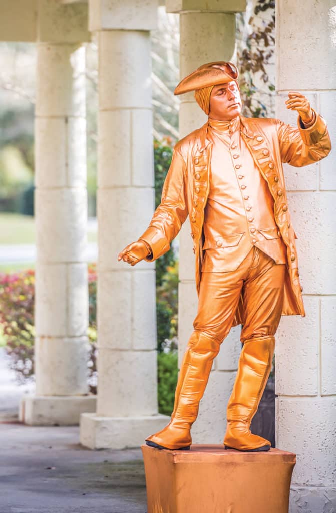 Living statue of a gold man