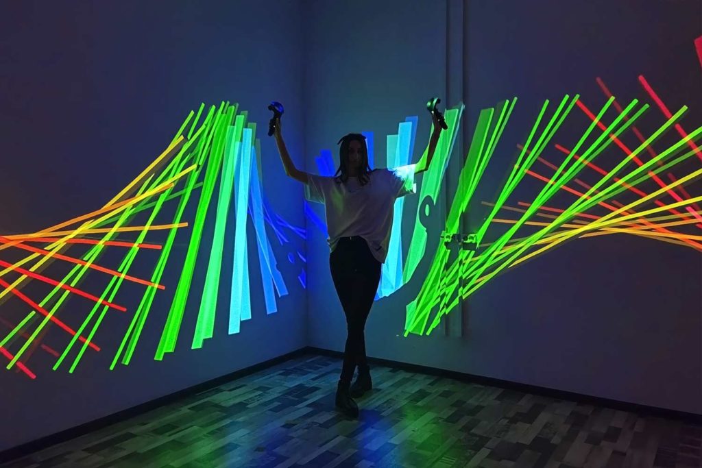 Dancer operates the effects using VR controllers