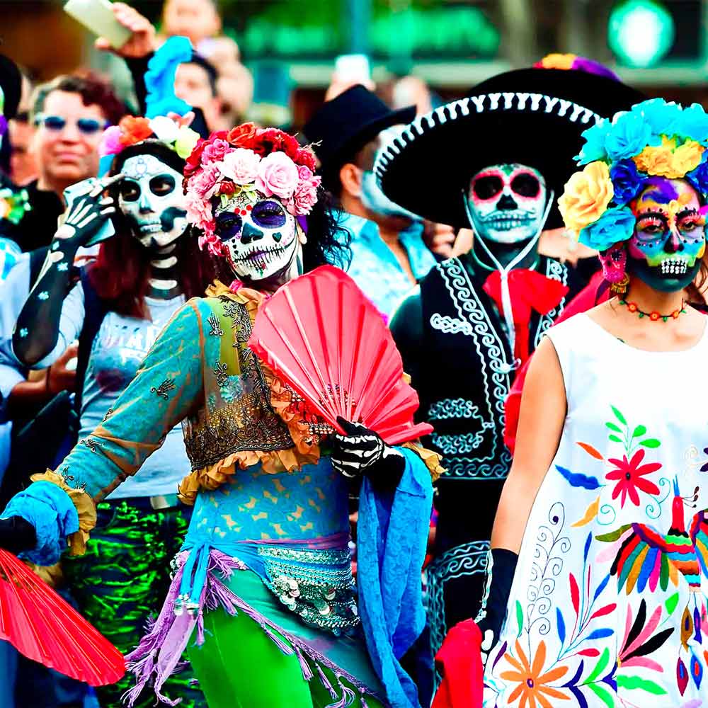 Death and Life are coming together in sugar skulls and clothes of colorfull or black.