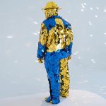 broken-man-yellow-blue-suit