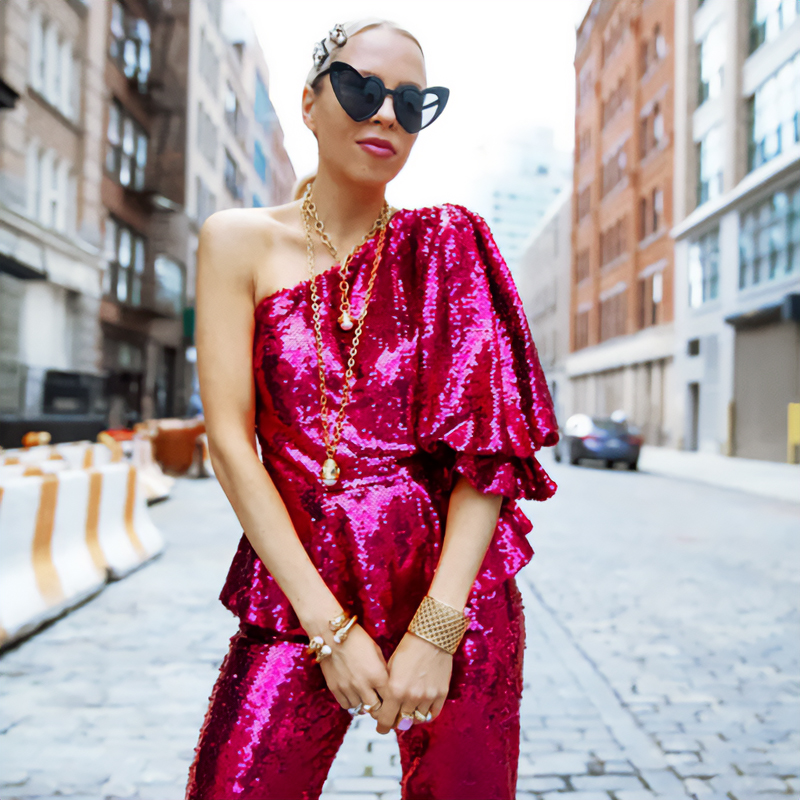 A shiny pink suit is the best idea of a Christmas outfit.